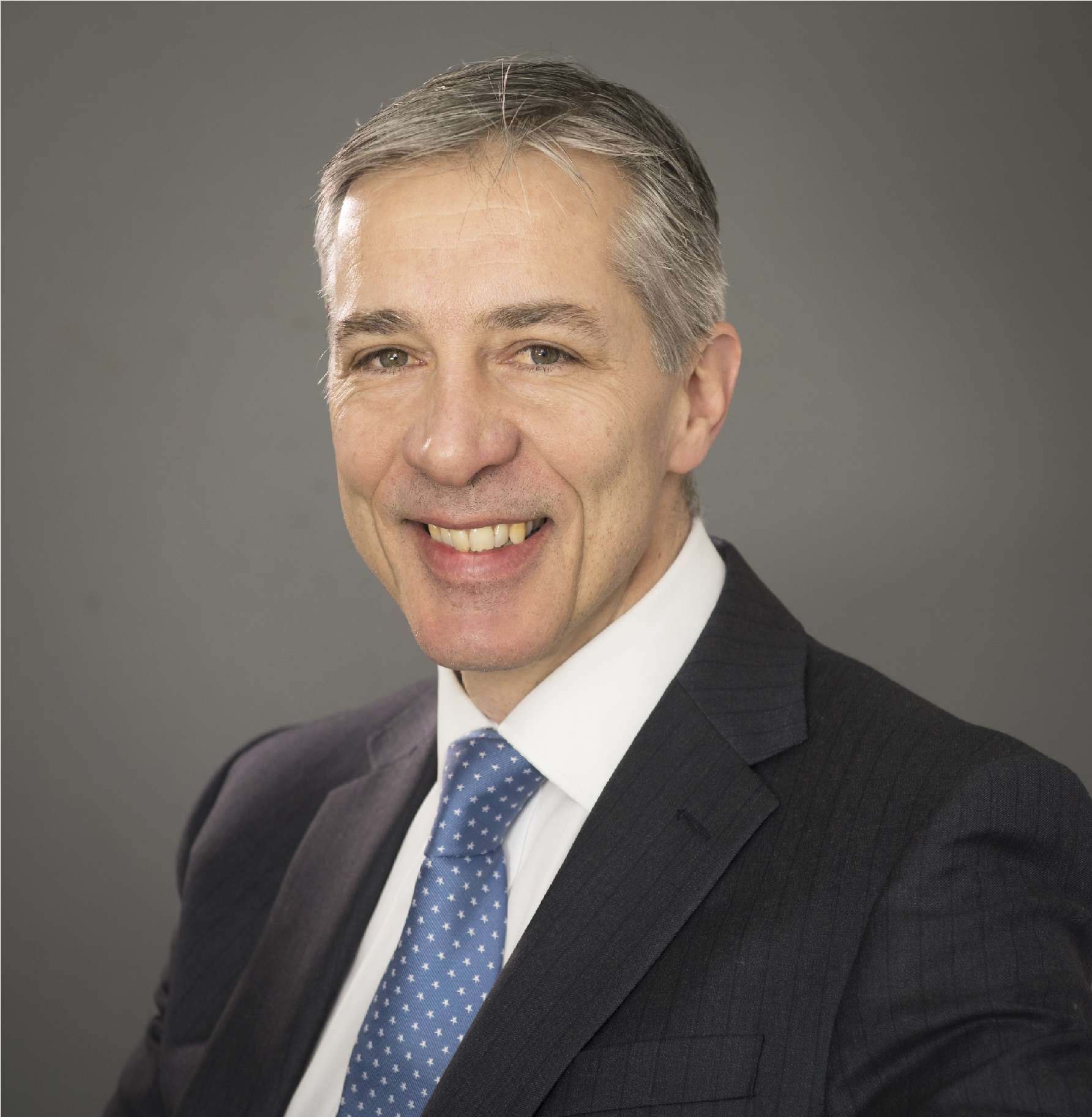 Headshot of Dr Nigel Wells, the clinical lead with NHS Humber and North Yorkshire Integrated Care Board smiling