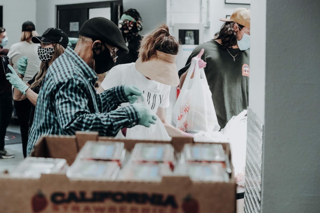 People sorting through food bags