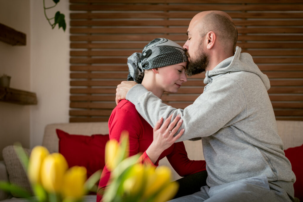 Two people sat down hugging