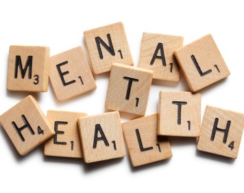 Scrabble tiles spell out the words 'mental health'