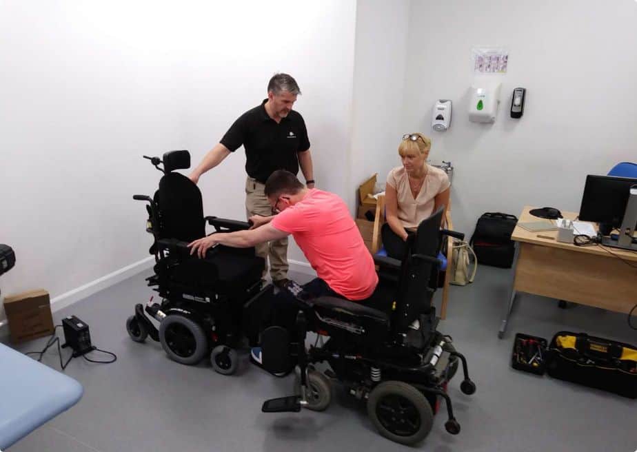A wheelchair assessment is taking place in this image