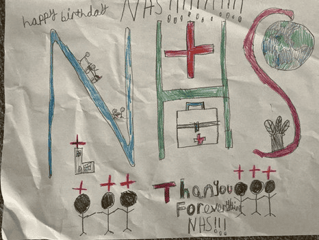 The drawing has text that says "Happy birthday NHS. Thank you for everything!" The drawing has the word "NHS" in the centre of the page with different hospital scenarios around the letters.