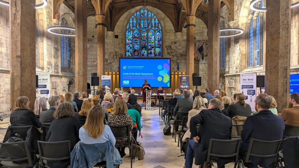 Sue Symington addresses Child of the North Symposium in the York Guildhall.